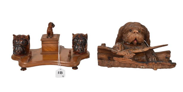 Two Antique Carved Wood Figural Dog Inkwell Stands - Comprising: A Black Forest Carved Sheepdog: Two Antique Carved Wood Figural Dog Inkwell Stands - Comprising: A Black Forest Carved Sheepdog Inkwell & Stand, depicting a sheepdog holding onto a hollow log, 4 5/8" h x 9 1/2" w x 7" d. A Victorian