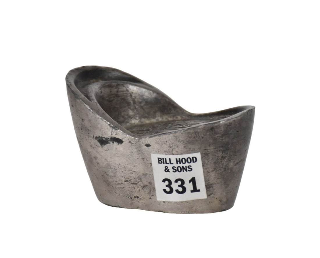 A Chinese Silver Ingot Sycee - A Chinese silver boat-shaped ingot. With stamps to underside and (1 of 6)