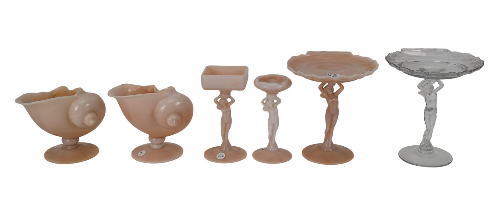 6 Pc. Cambridge Crown Tuscan Glass Lot, incl; 2 Nautilus Shells (5 1/2"h x 6 7/8"w), One Nude Statue: 6 Pc. Cambridge Crown Tuscan Glass Lot, incl; 2 Nautilus Shells (5 1/2"h x 6 7/8"w), One Nude Statue (8"h x 7 1/4"w), Crown Tuscan Tazza, One Clear Tazza, Nude Stem Crown Tuscan-Ivory Ashtray and Nude