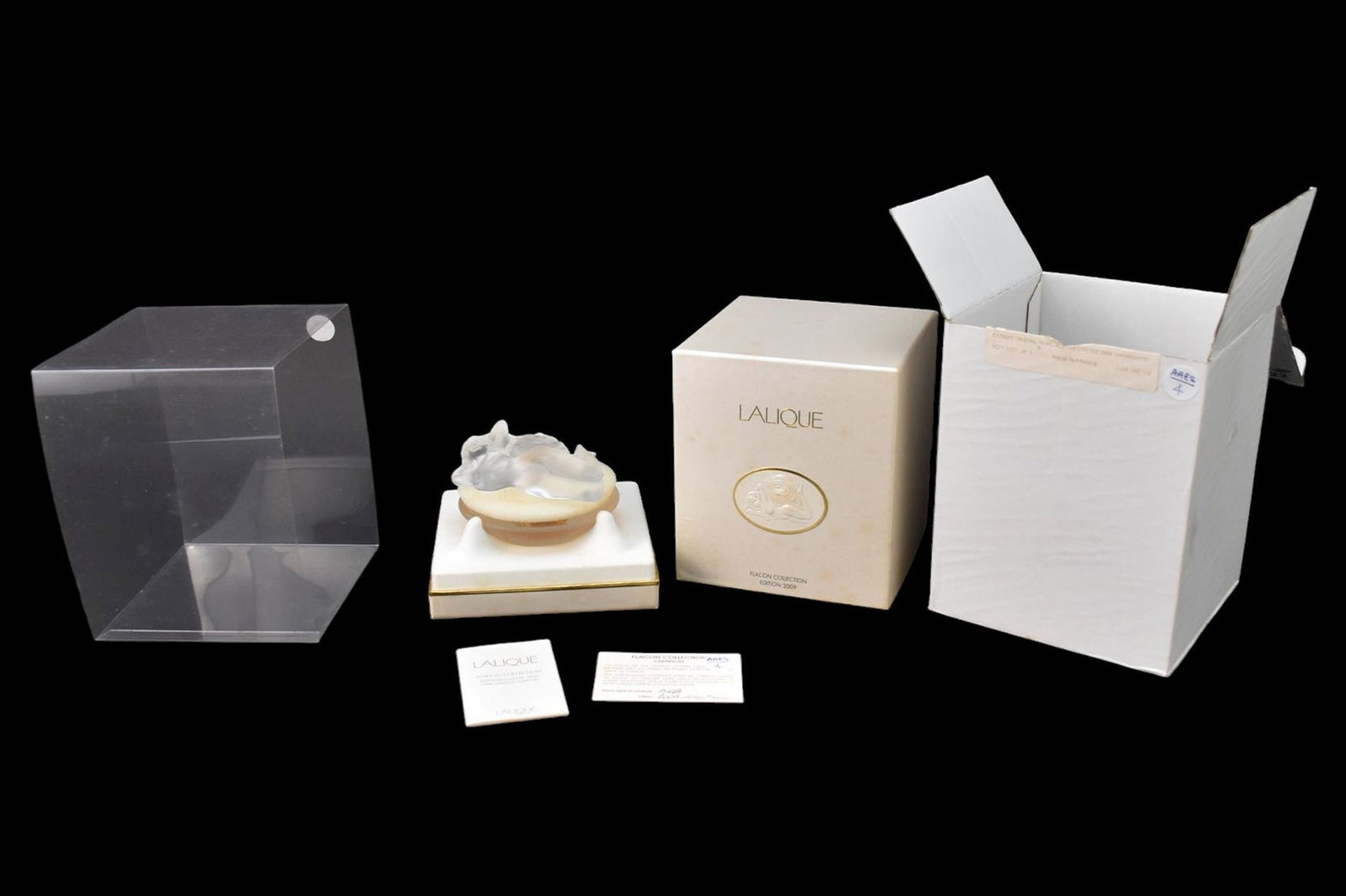 LALIQUE “Aphrodite" Perfume 21st Century Edition launched in 2009. Bottle with frosted crystal: LALIQUE “Aphrodite” Perfume 21st Century Edition launched in 2009. Bottle with frosted crystal depicting Aphrodite. In a 30ml-1.0 FL. Oz bottle. Etched “Lalique France, B674”. With cer