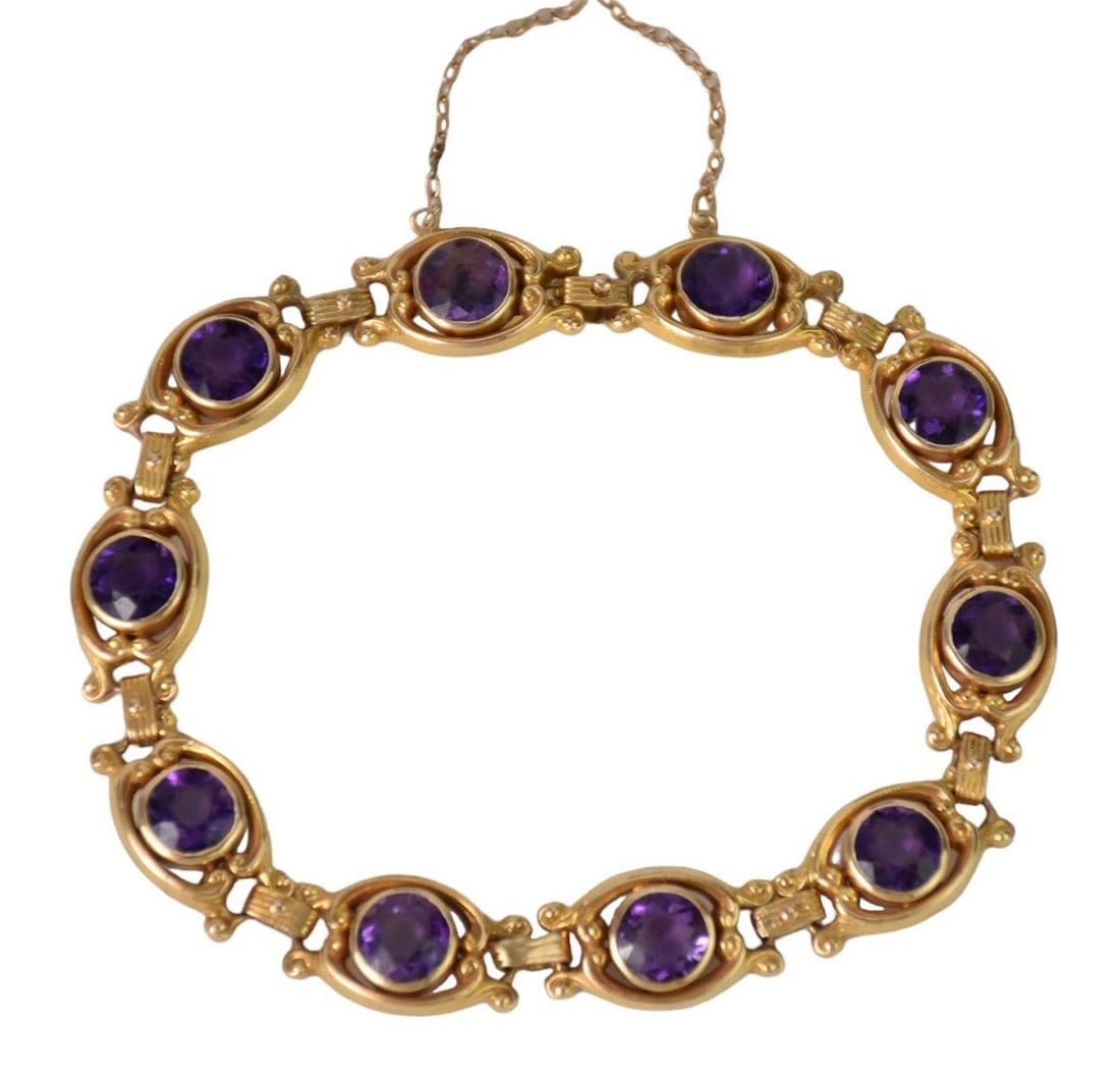 14K Yellow Gold and Amethyst Link Bracelet. Featuring ten round-cut amethyst. Clasp marked (1 of 3)