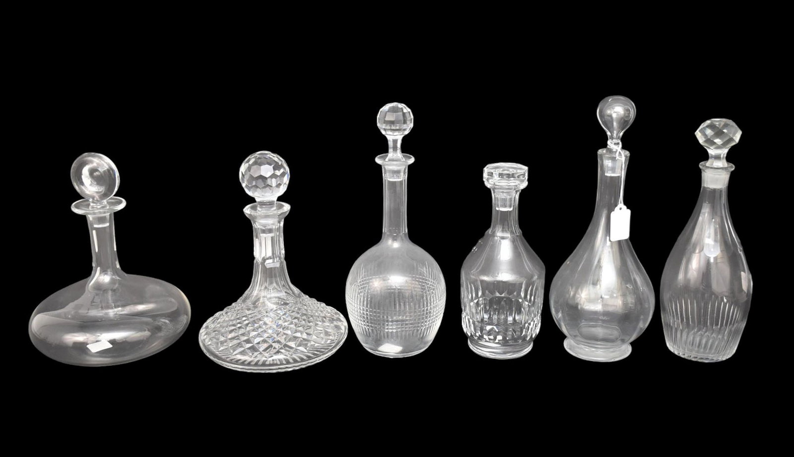 Group of Six Crystal Decanters, Four Baccarat, One Waterford - Collection of four Baccarat France: Group of Six Crystal Decanters, Four Baccarat, One Waterford - Collection of four Baccarat France clear crystal decanters, one Waterford, one unsigned. Comprising: A) Montaigne Optic decanter, 12 3/4"