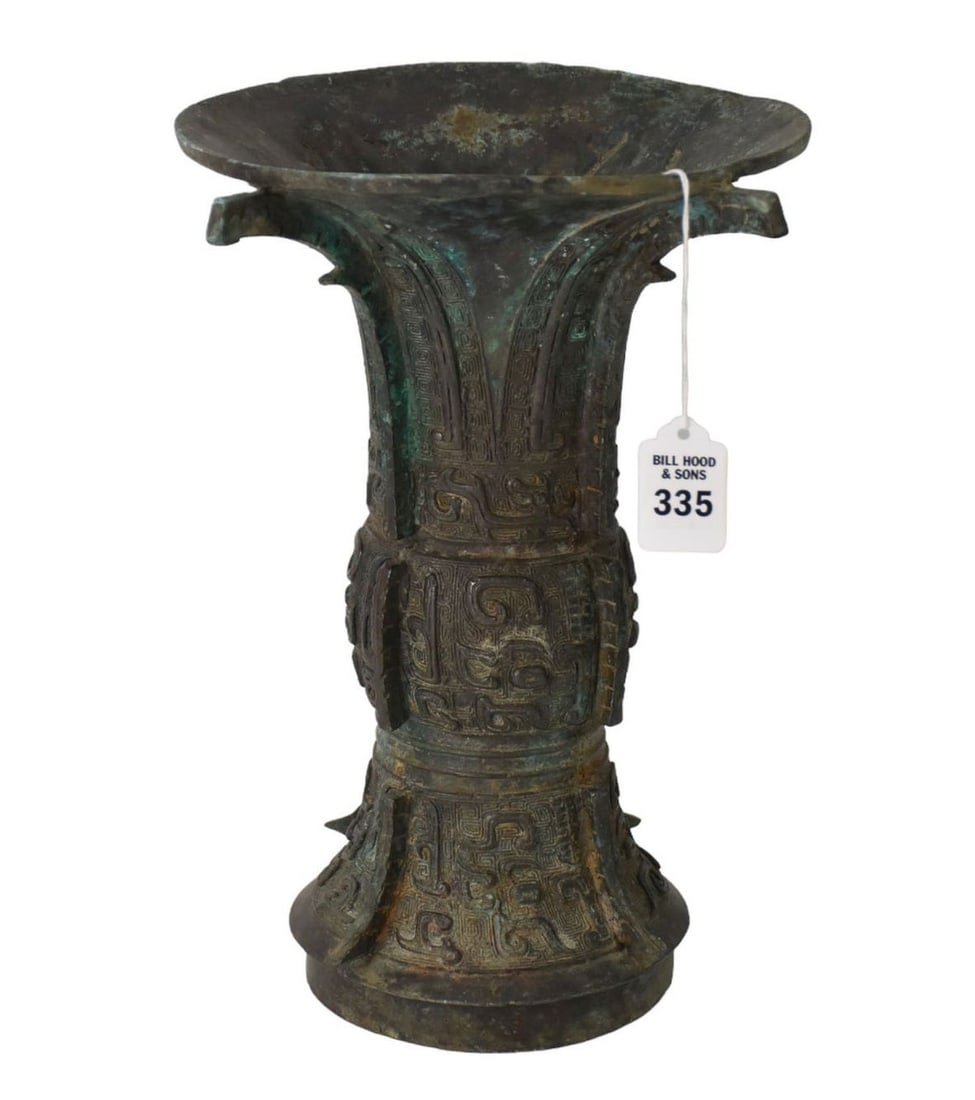 Chinese Archaic Ritual Bronze Gu Wine Vessel - A bronze "Gu" ritual wine vessel. Shang or Zhou: Chinese Archaic Ritual Bronze Gu Wine Vessel - A bronze "Gu" ritual wine vessel. Shang or Zhou style. Aged patination, elaborate archaic designs, wide flaring mouth. The interior underside with "fish 