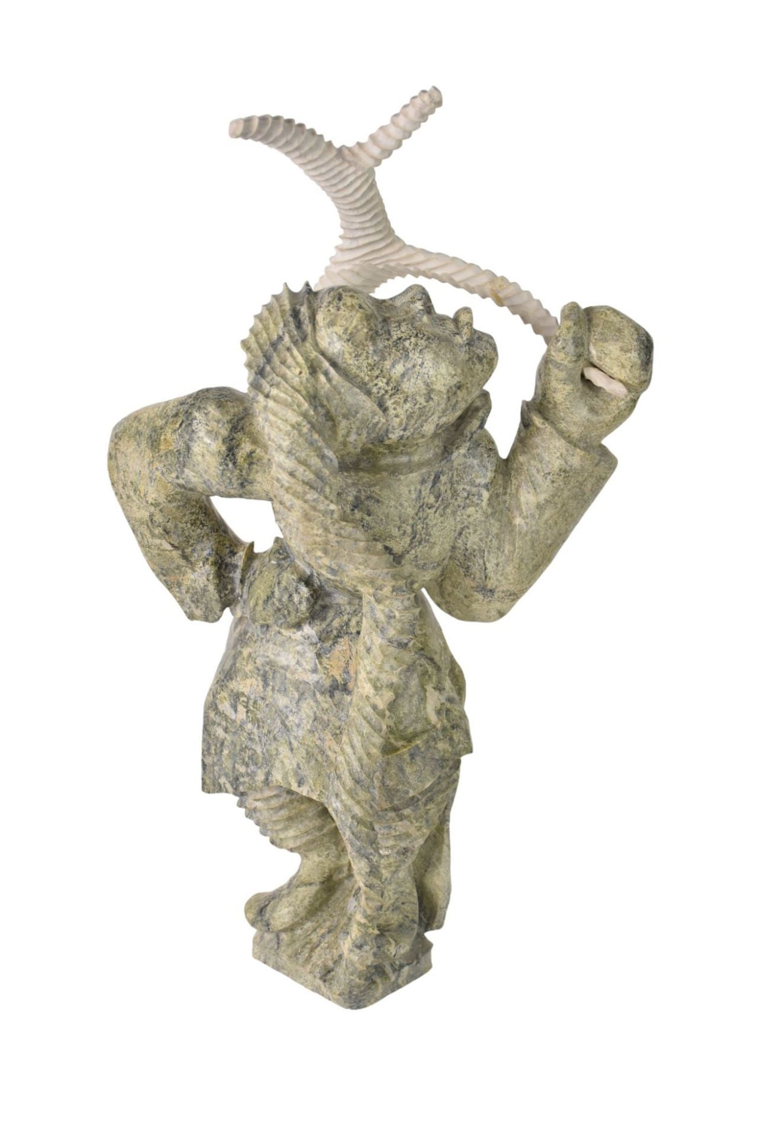 Inuit Eskimo Serpentine Figural Sculpture, Canada - An Inuit green serpentine carving of a female: Inuit Eskimo Serpentine Figural Sculpture, Canada - An Inuit green serpentine carving of a female figure holding a carved bone arraratus. Underside signed in syllabics, Canada Eskimo Art decal, decal