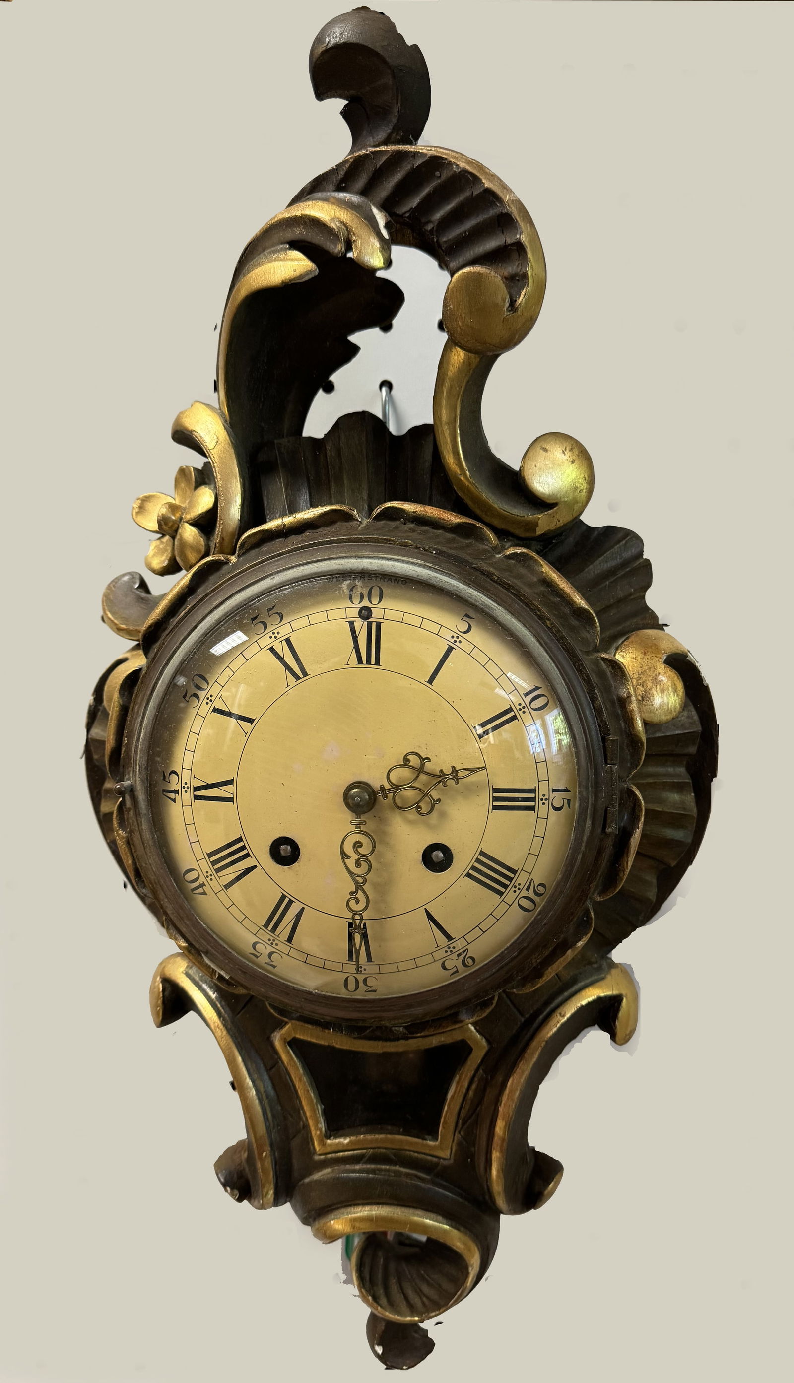 Swiss Westerstrand Scroll Form carved Clock: Swiss Westerstrand Scroll Form Clock carved with giltwood highlights, height 21 inches tall x 11 inches wide.