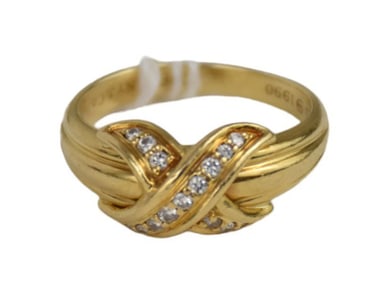 Tiffany & Co Diamond Signature X Ring Size 7.5. 1990 wt. 6.5 grams It contains 15 round g and VS