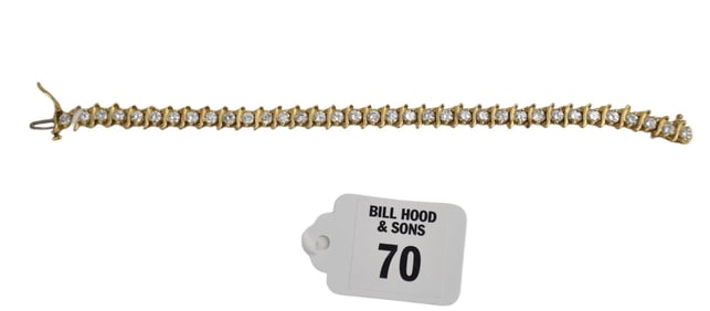 14K Yellow Gold Diamond Tennis Bracelet. Size 6.5" wt. 17.4 grams. Approx 5 tcw,  35 round diamonds