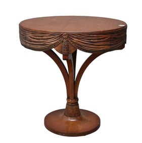 Mahogany occasional drum table with carved drape motif apron on center pedestal 29"h x 28"d