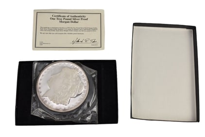 1878 One Troy Pound Silver Proof Morgan Dollar.  Silver Dollar measures 3.5" in diameter and is