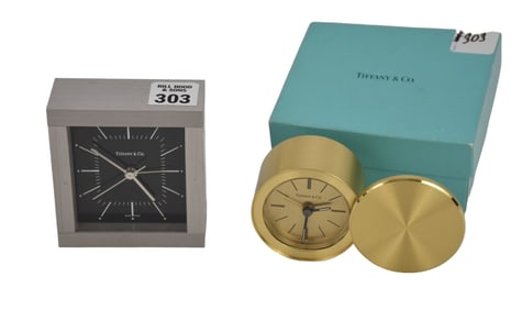 2 Tiffany & Co. Travel Clocks, Steel (3 1/4" x 3 1/2") and Round Brass (2 1/2")