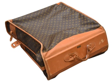 A vintage Louis Vuitton garment bag luggage, featuring brown printed monogram coated canvas, brass