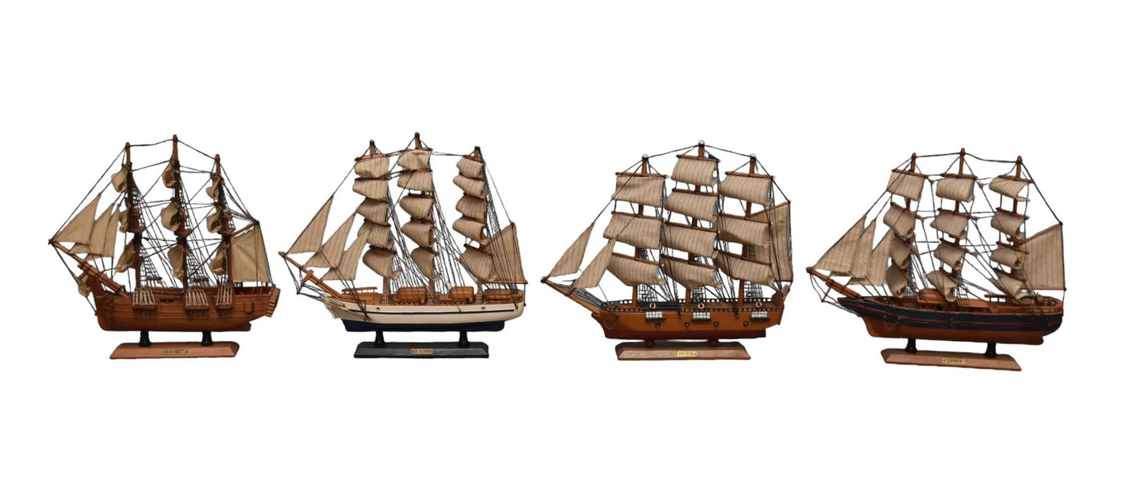Four Model Ships - A group of four wooden model ships with cloth sails. Comprising: HMS Bounty (17: Four Model Ships - A group of four wooden model ships with cloth sails. Comprising: HMS Bounty (17 1/2" H x 17 1/2" L), Tea Clipper (18" H x 19 3/4" L), Clipper (17 3/4" H x 20 1/2" L), Frigate (17 1/