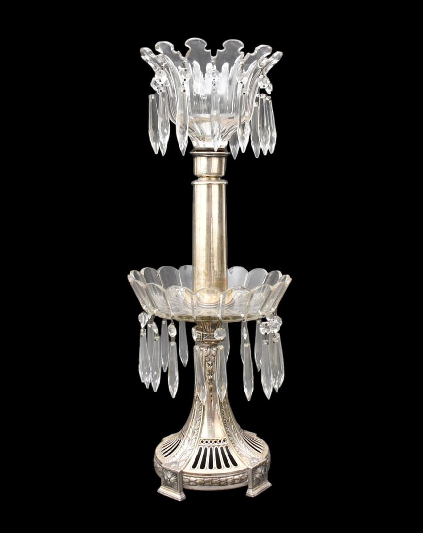 A Silverplate & Cut Glass Mantle Luster Lamp Assemblage - A mantel luster assembled (marriage) from: A Silverplate & Cut Glass Mantle Luster Lamp Assemblage - A mantel luster assembled (marriage) from cut glass, silverplated column and base, and hanging prisms. 22 3/8" h.
