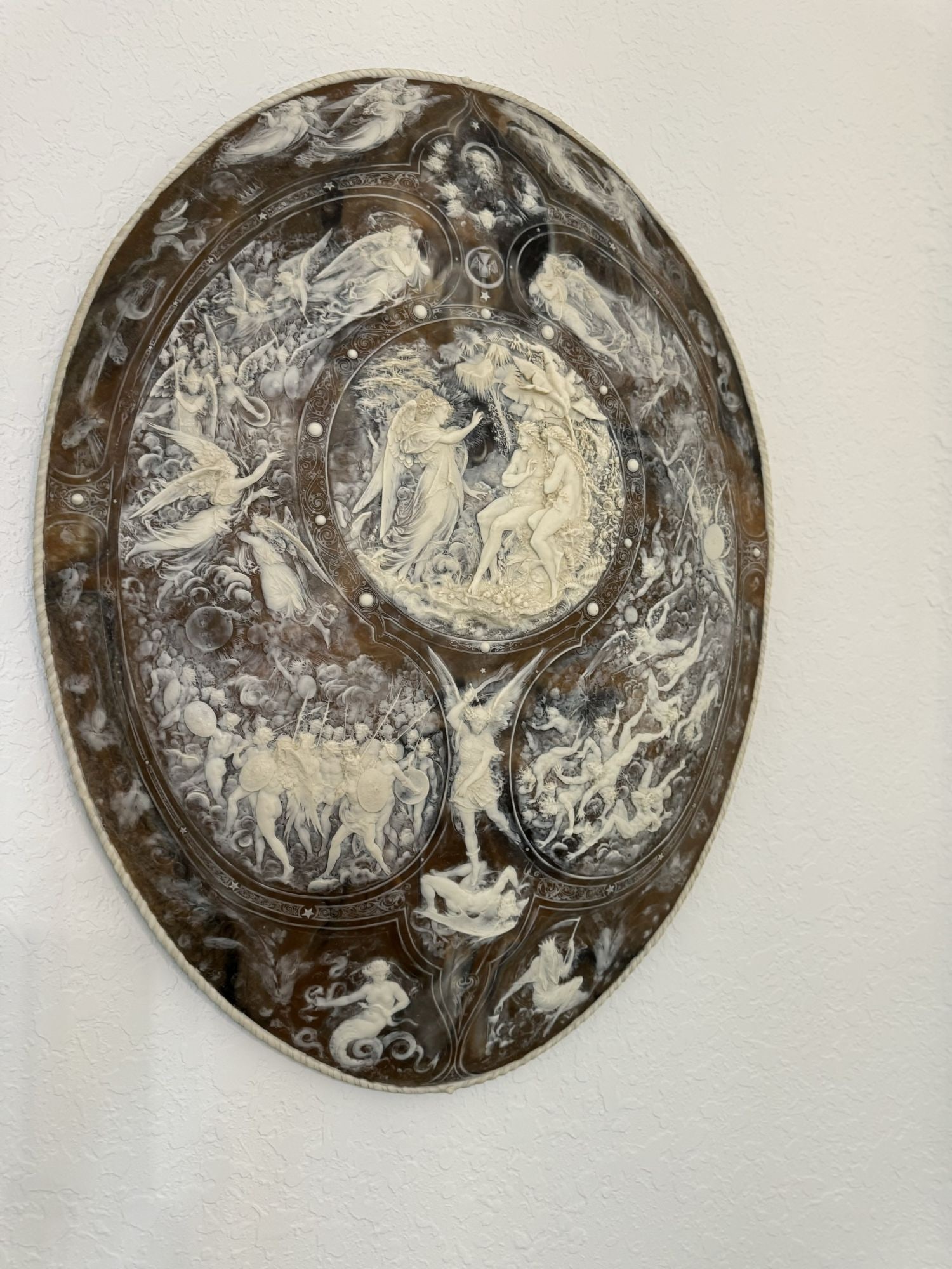 "Milton Shield" Cast Composite Stone Wall Ornament, Originally Designed by Leonard Morel-Ladeuil: "Milton Shield" Cast Composite Stone Wall Ornament, Originally Designed by Leonard Morel-Ladeuil (French, 1820-1888) in 1867. The Shield Illustrates John Milton's "Paradise Lost", Central Medallion De
