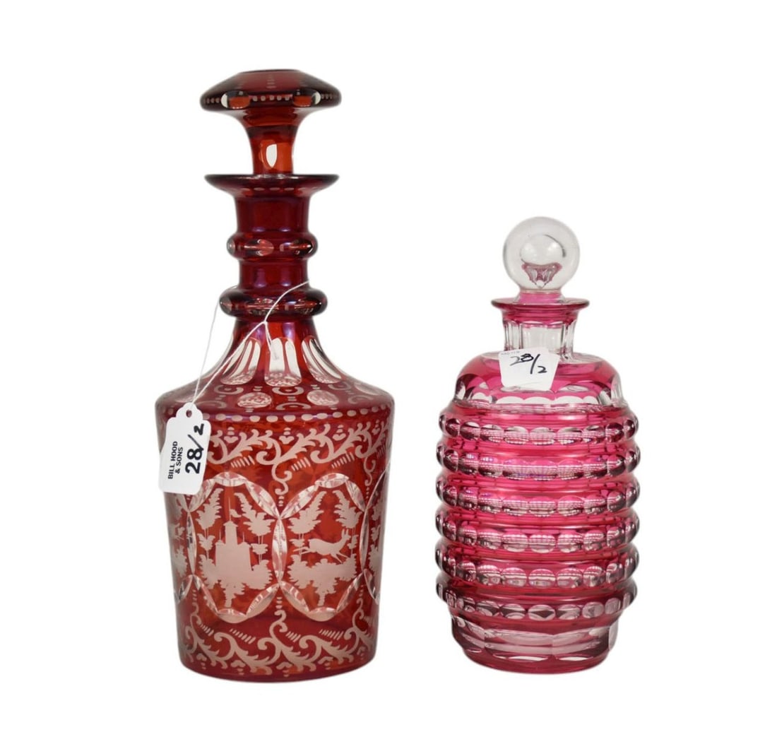 2 Cranberry to Clear Cut & Polished Glass Decanters, 9"h & 12"h, one signed for Val St Lambert,: 2 Cranberry to Clear Cut & Polished Glass Decanters, 9"h & 12"h, one signed for Val St Lambert, small fleabite to base of stopper, the other with chip to stopper