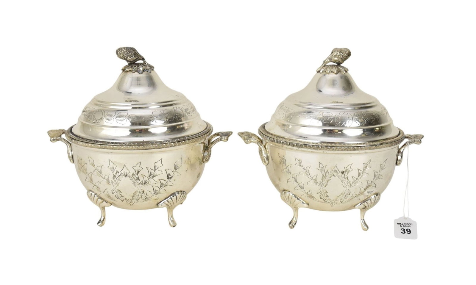 Pair Silverplate Covered Serving Dishes - Each of round form, double-handled, and upon four: Pair Silverplate Covered Serving Dishes - Each of round form, double-handled, and upon four shell-topped feet. With domed covers topped with berry finial. Each side of the body and a band on each cove