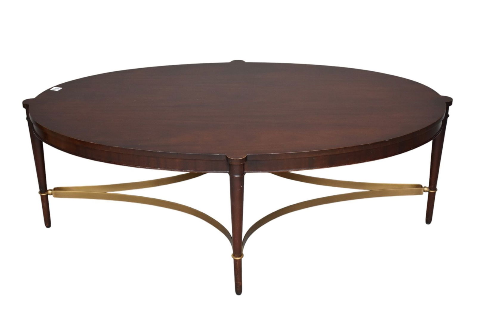 Baker Oval Coffee Table with Brass Stretcher Base, Thomas Pheasant Collection Label, 16 1/2"h x 48: Baker Oval Coffee Table with Brass Stretcher Base, Thomas Pheasant Collection Label, 16 1/2"h x 48 1/2"w x 30 1/2"d