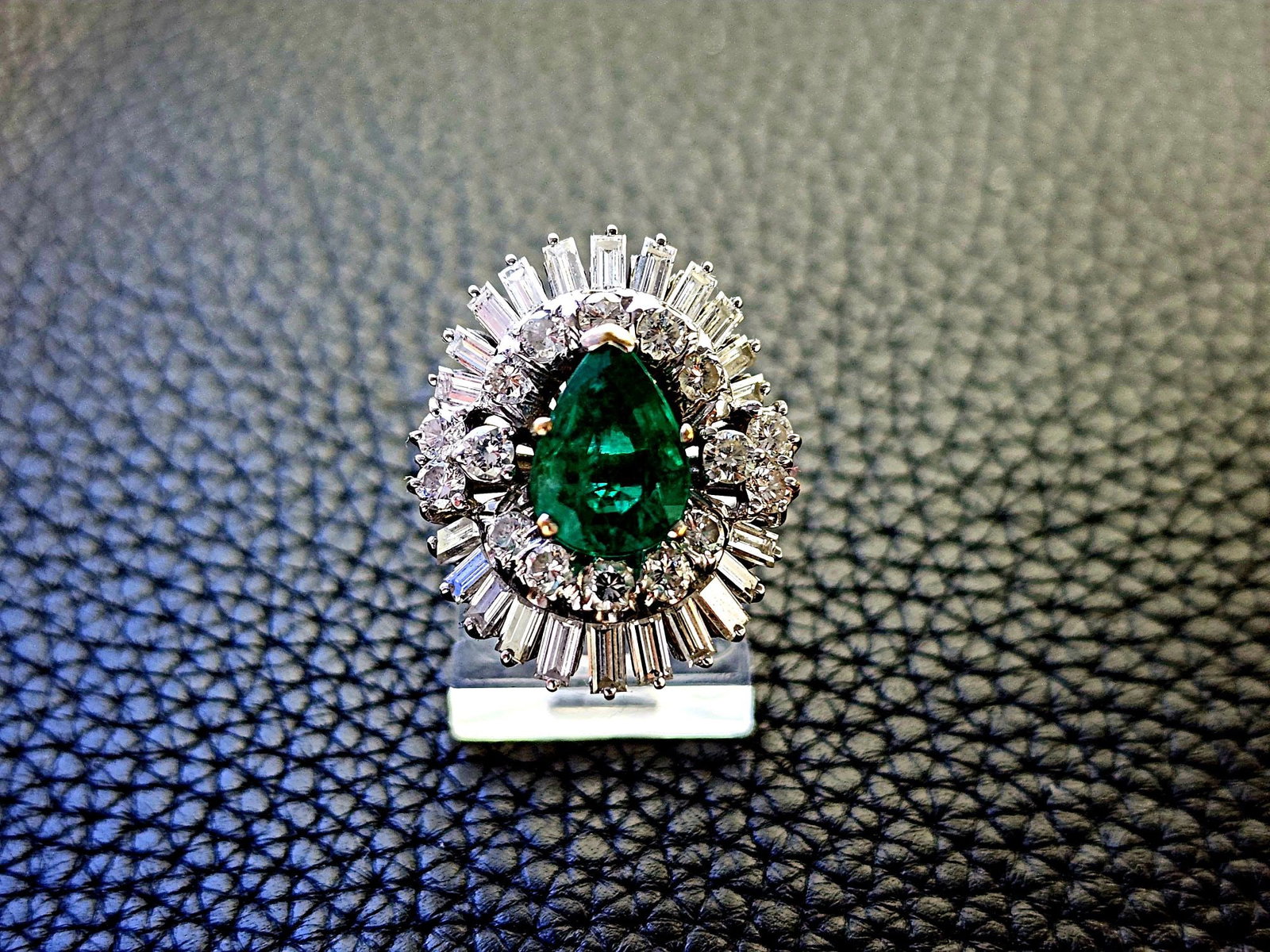 GIA 2.15ct Brazilian Emerald F1 Crafted in Platinum with 18k Yellow Gold setting of the teardrop: GIA 2.15ct Brazilian Emerald F1 Crafted in Platinum with 18k Yellow Gold setting of the teardrop shape. Featuring at 2.15 carat very rich green Brazilian Emerald positioned at the center of the artful