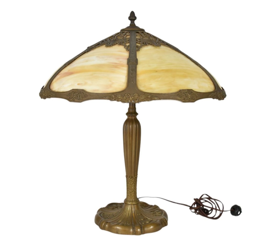 Antique Slag Glass Lamp - c. 1920s. Ornate patinated metal base, two-light fixture. The shade with: Antique Slag Glass Lamp - c. 1920s. Ornate patinated metal base, two-light fixture. The shade with reticulated frame and caramel to cream colored slag glass. Overall height - 22 1/2", Shade - 18 1/2" 