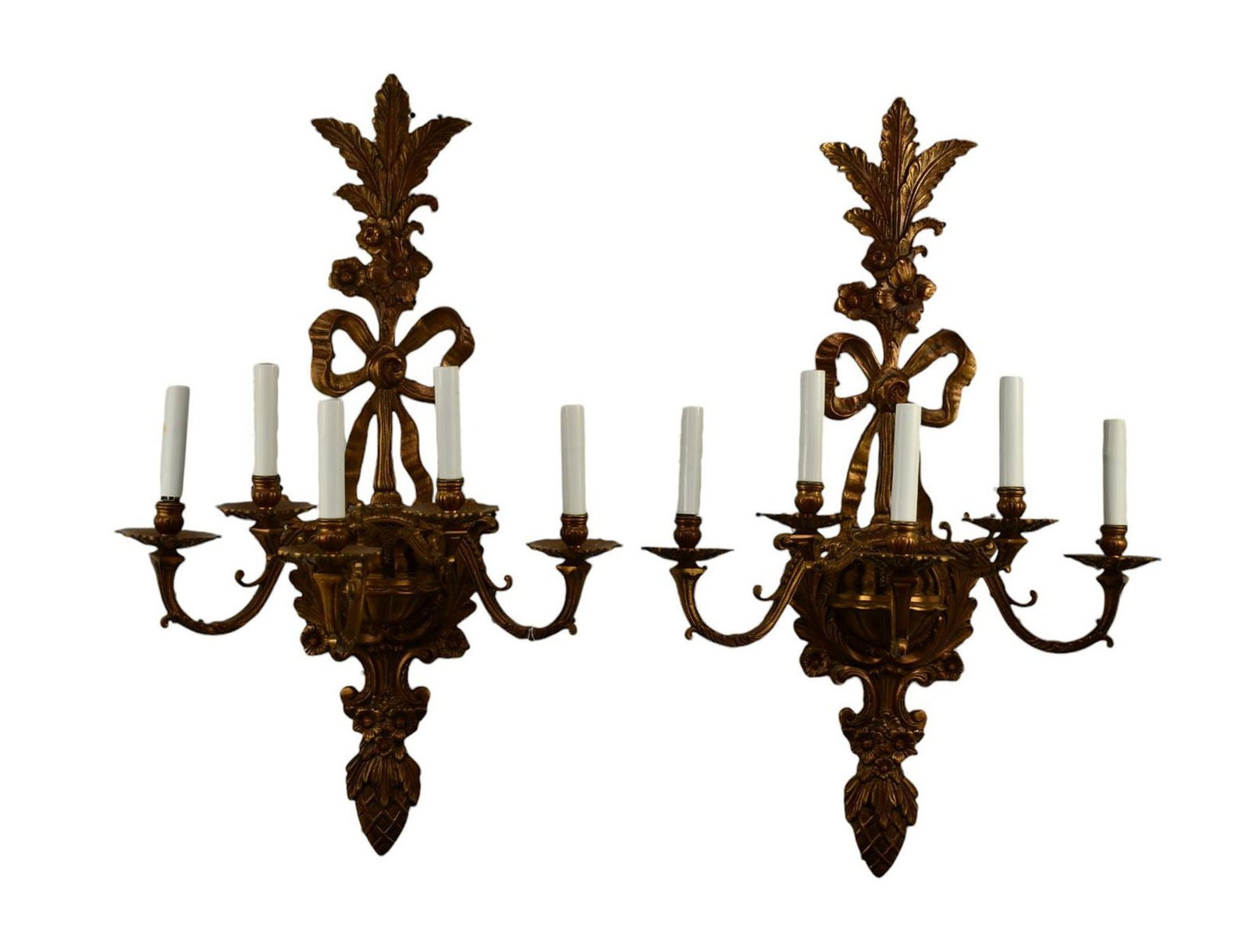 Pair of Cast Bronze Wall Sconces, Late 20th/ Early 21st Century, Each with five candle arms and: Pair of Cast Bronze Wall Sconces, Late 20th/ Early 21st Century, Each with five candle arms and feather and ribbon crest. Electrified. Traces of red and black highlights. H. 29 ½” X W. 17