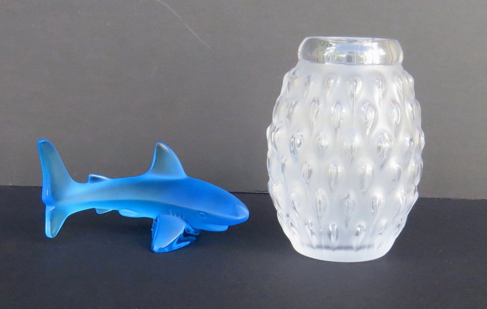 Two LALIQUE Crystal items. First: Blue ATLANTIS PARADISE ISLAND Shark figure, 5 inches long;: Two LALIQUE Crystal items. First: Blue ATLANTIS PARADISE ISLAND Shark figure, 5 inches long; engraved LALIQUE-FRANCE signature and sticker label. Second: FIGUERA Crystal Vase by Marie-Claude Lalique; 