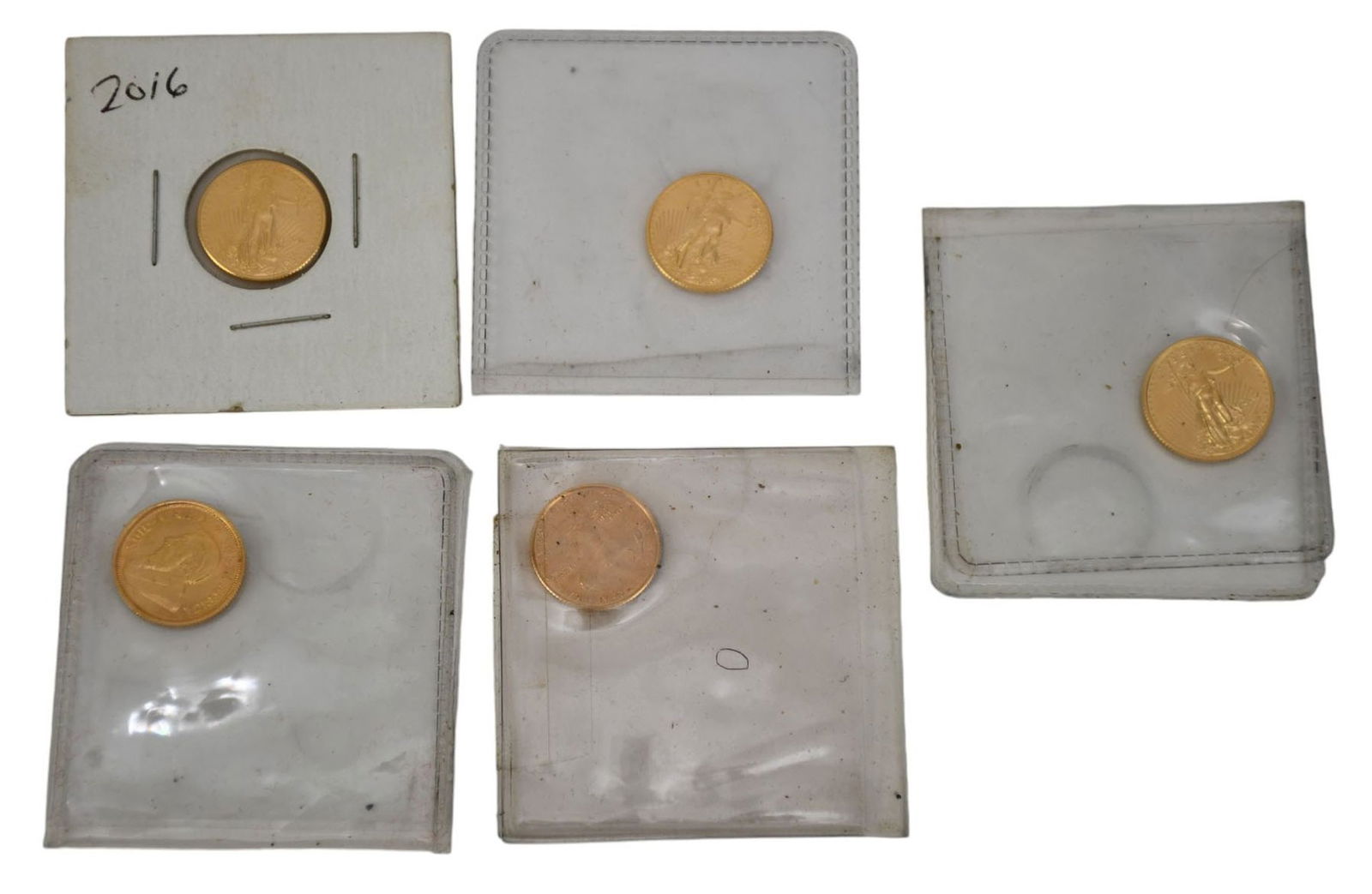 4 - 1/10 oz American Gold Eagle Coins & 1 South Africa 1/10 Krugerrand 1984. American eagles are: 4 - 1/10 oz American Gold Eagle Coins & 1 South Africa 1/10 Krugerrand 1984. American eagles are 1999, 2013, 2016 and 2017