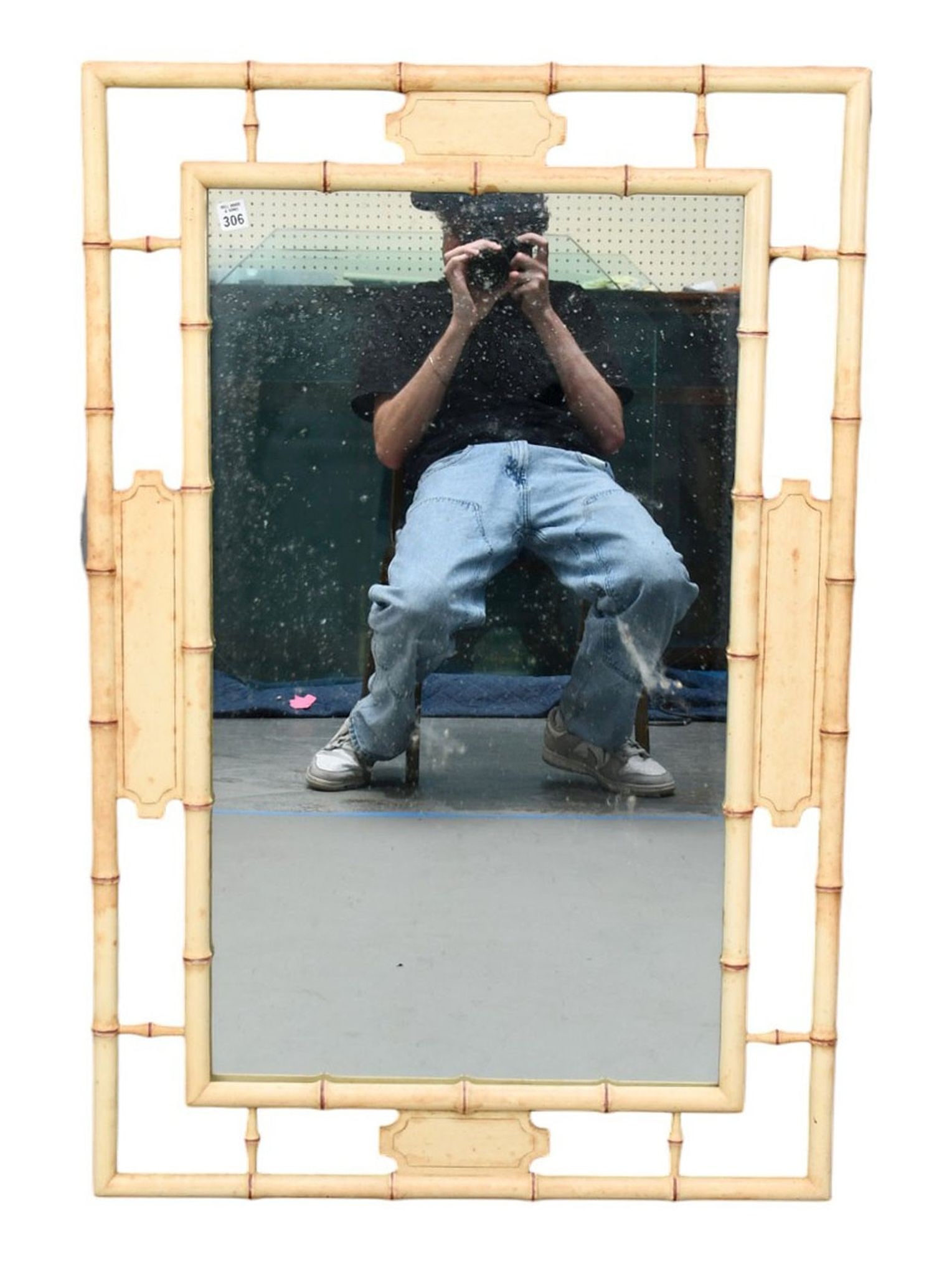 Bamboo Style Painted Wall Mirror, 20th Century, Commercial Quality. Pierced frame ornamented with: Bamboo Style Painted Wall Mirror, 20th Century, Commercial Quality. Pierced frame ornamented with red highlights, H. 42 ½” x W. 17”, Condition: Fair