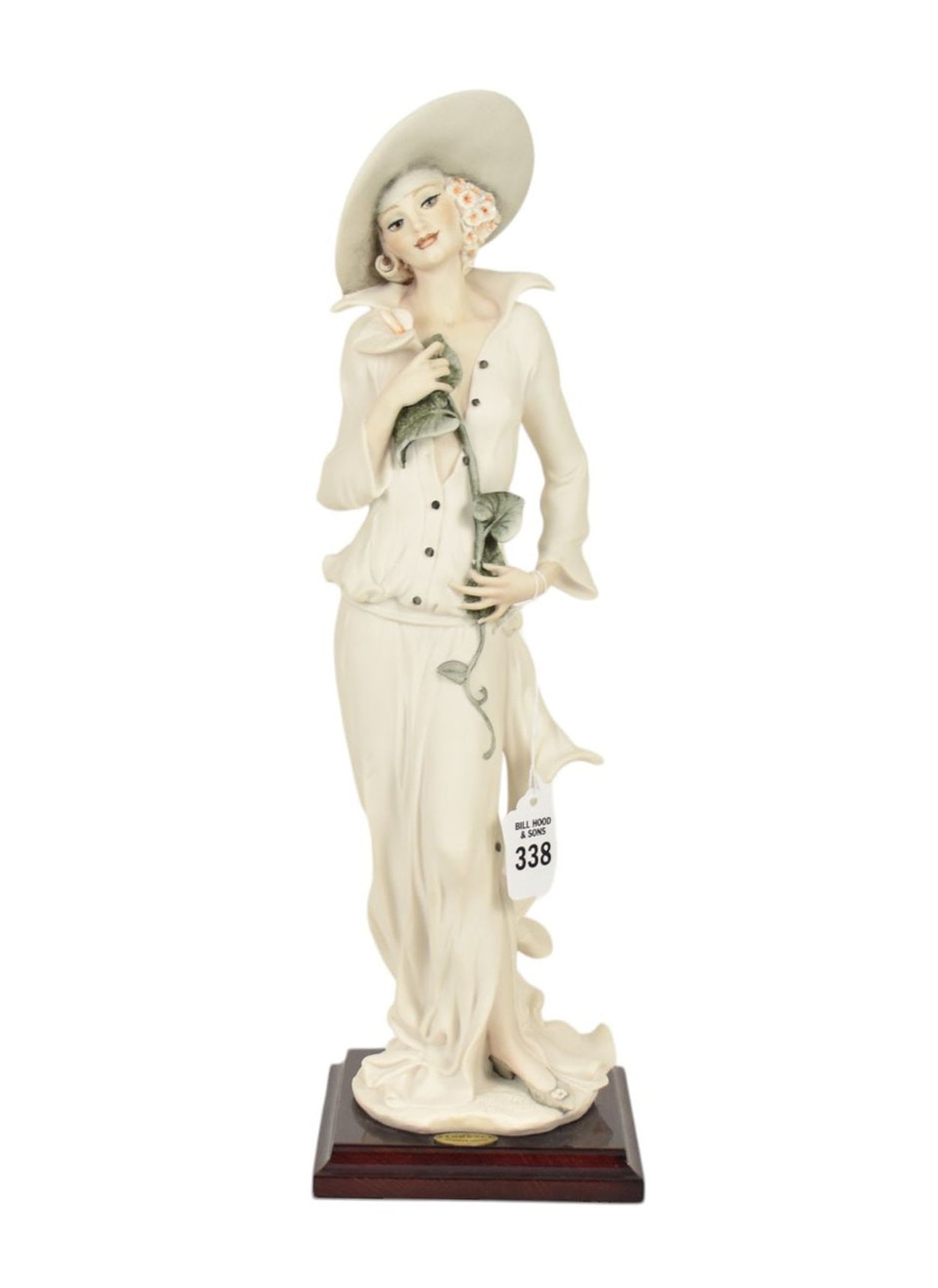 Giuseppe Armani "Grace" Figurine Capodimonte - G. Armani 1995 figurine of a woman standing with: Giuseppe Armani "Grace" Figurine Capodimonte - G. Armani 1995 figurine of a woman standing with calla lily at her chest. #0383F. Signed at base, Capodimonte crown mark at back, 1995 Florence. On a woo