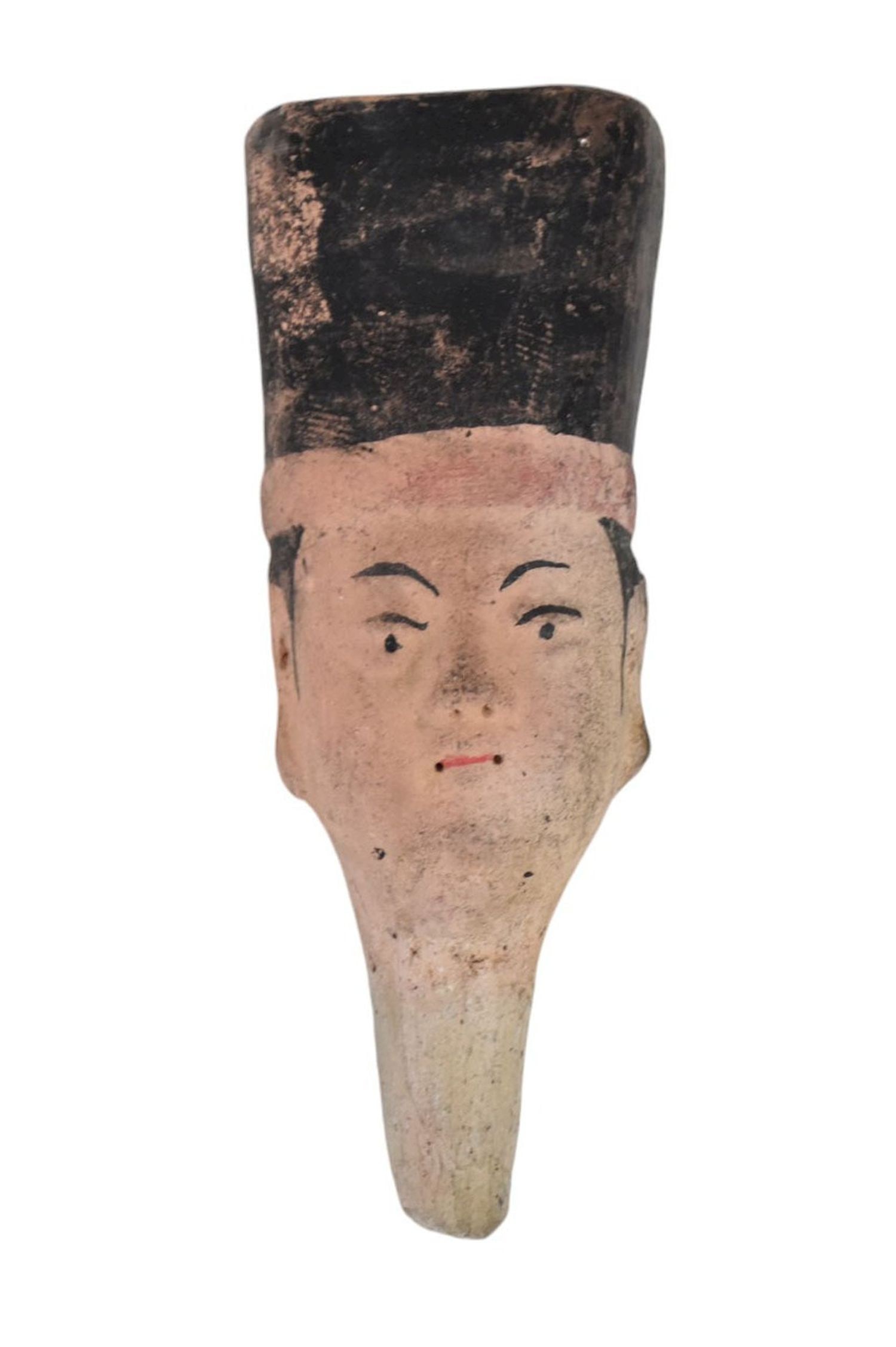 Chinese Terracotta Head of a Tomb Attendant - Ming-style pottery head, wearing a towering, flared: Chinese Terracotta Head of a Tomb Attendant - Ming-style pottery head, wearing a towering, flared and flat-topped cap, polychrome pigments, pierced at ears. 5 5/8" h. Condition: some pigment losses