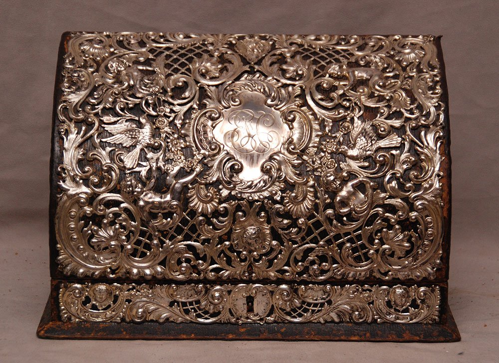 Fitted interior letter box with ornate silver repo: Fitted interior letter box with ornate silver repousse design, front & sides, does open but no key to lock, 9"h x 13"w (very worn on sides)