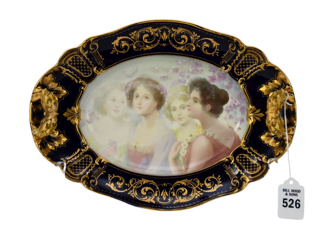 Vienna Porcelain Tray Cobalt Blue Ground, Late 19th Century - Of shaped oval form flanked by upright: Vienna Porcelain Tray Cobalt Blue Ground, Late 19th Century - Of shaped oval form flanked by upright double satyr-mask handles, painted with beauties surrounded by garlands and branches of flowers in 