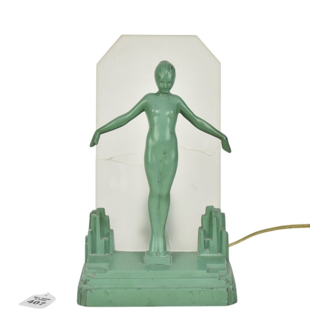Art Deco Frankart Figural Lamp, C. 1928 - A green painted metal Art Deco nude figure light. With: Art Deco Frankart Figural Lamp, C. 1928 - A green painted metal Art Deco nude figure light. With frosted glass plaque "shade". Single light fixture. Marked on verso "C 1928 Frank Art; Pat. 76612". 10