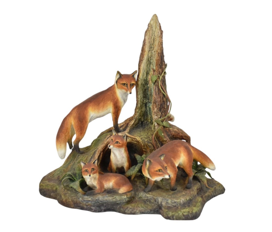 Boehm porcelain Fox Grouping: (4) foxes retreating from a lair in a tree trunk; marked “limited (1 of 9)