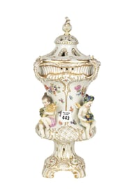 GERMAN PORCELAIN COVERED URN, Late 19th-Early 20th Century, A footed urn with reticulated cover,