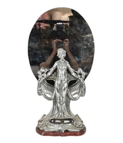 Continental Silveroid Glass and Rose Marble Mirror, The oval mirror supported by a standing female