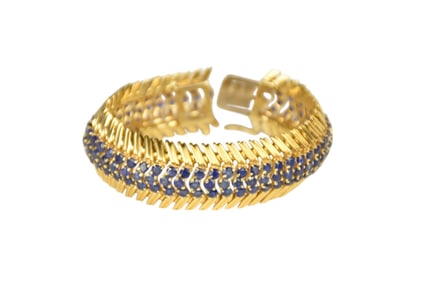 18K Yellow Gold Sapphire Bracelet. 134 round Sapphires. Length 6.5" and .75" wide wt. 80 grams