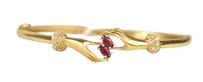 14K Yellow Gold Hands Holding Rubies Bracelet. Wt. 14.2 grams 6" inner circumference with 3" opening
