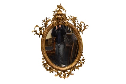 Antique Oval Mirror Giltwood Carved Frame, Scrolls Leaves, Cupids, Some Age Cracks, 54"h x 37"w