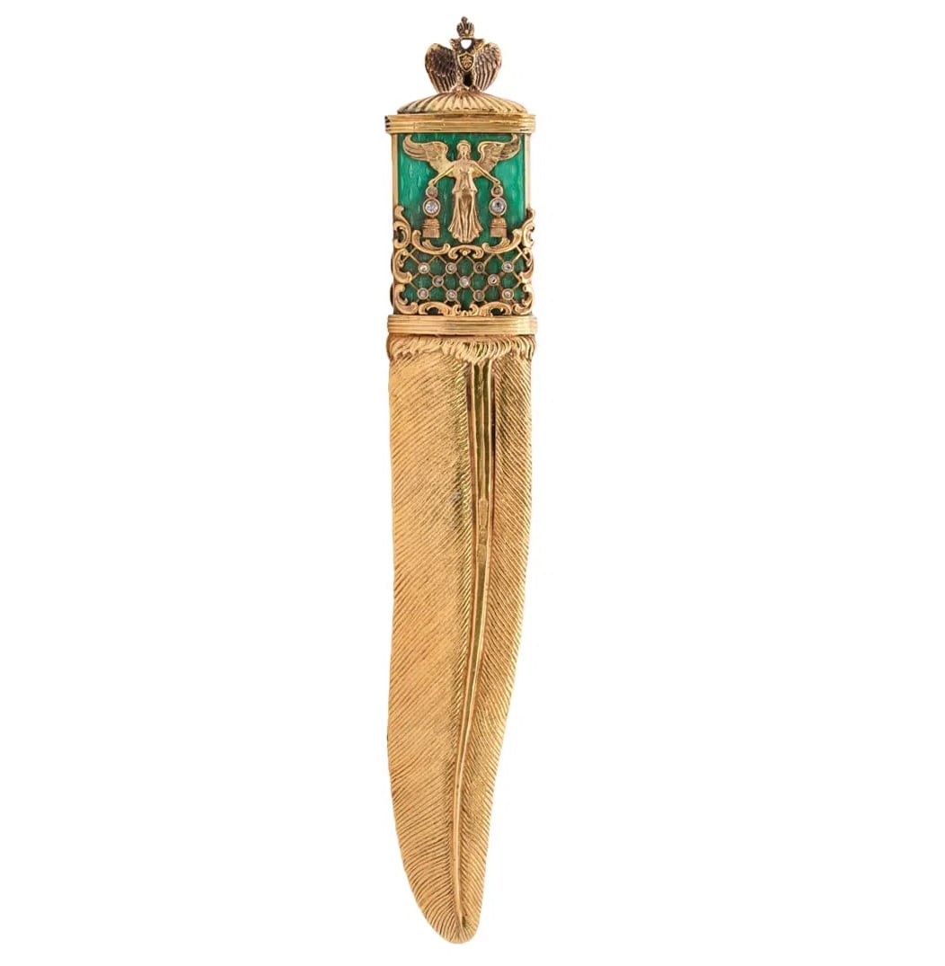 Russian Antique letter opener, the gilt silver blade in the form of a feather, both sides of the: Russian Antique letter opener, the gilt silver blade in the form of a feather, both sides of the handle ornamented with green guilloche enamel, a gilt silver trellis motif and winged figure, and inset