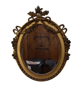 Oval Beveled Mirror with Gilt Carved Trophy Bows and Draping Garland Motif, 36"hx30"w