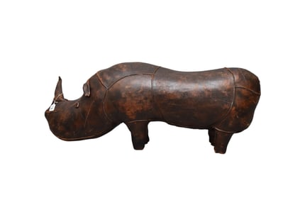 Vintage stuffed leather rhinoceros Has some heavy wear, Missing tail and there is a rip on the edge