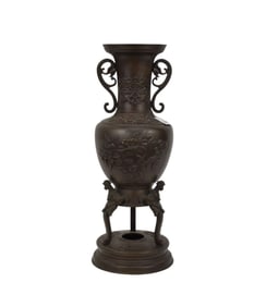 Bronze Double Handled Urn with Raised Floral Motif, on Trifed Supports, 15 1/2"h x 5 1/2"d