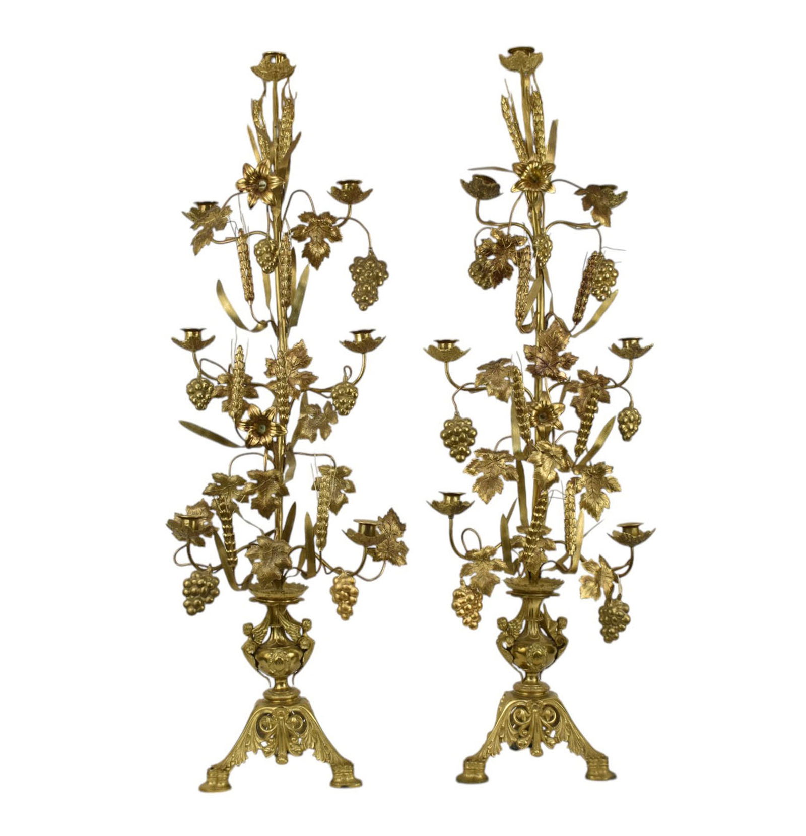 PAIR OF CONTINENTAL GILT BRASS 7-LIGHT CANDLEABRAS, pressed- and cast-brass construction featuring (1 of 8)