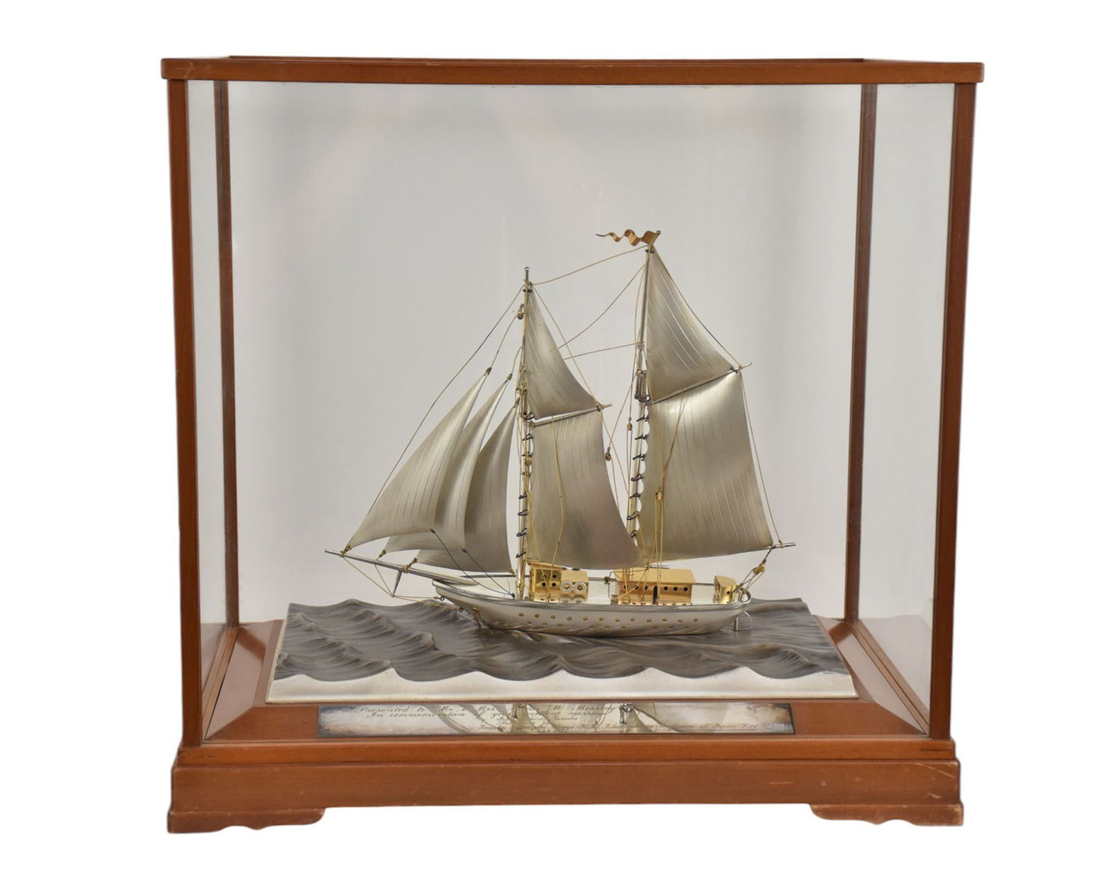 Seki Takehiko, Sterling Silver Yacht, Japan - Mid-20th century. A large two-mast sailboat yacht by: Seki Takehiko, Sterling Silver Yacht, Japan - Mid-20th century. A large two-mast sailboat yacht by Seki Takehiko (Japanese, b. 1908). The ship being sterling silver and gold plated with a silver plate