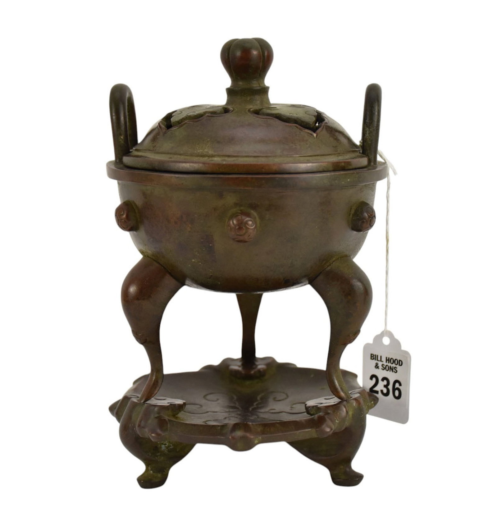 Chinese Bronze Covered Censer with Stand, Ruyi Motif - A patinated bronze censer of ovoid form, atop: Chinese Bronze Covered Censer with Stand, Ruyi Motif - A patinated bronze censer of ovoid form, atop three shaped supports, with floral bosses around body, two upright handles. The underside of censer