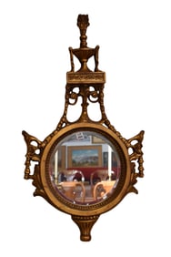 Carved Italian gilded round frame beveled mirror with urn and flame design at top 35" high x 20"