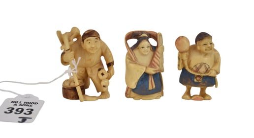 Three Figural Japanese Netsukes - Three carved Japanese Netsuke figures. Two with blue pigment are