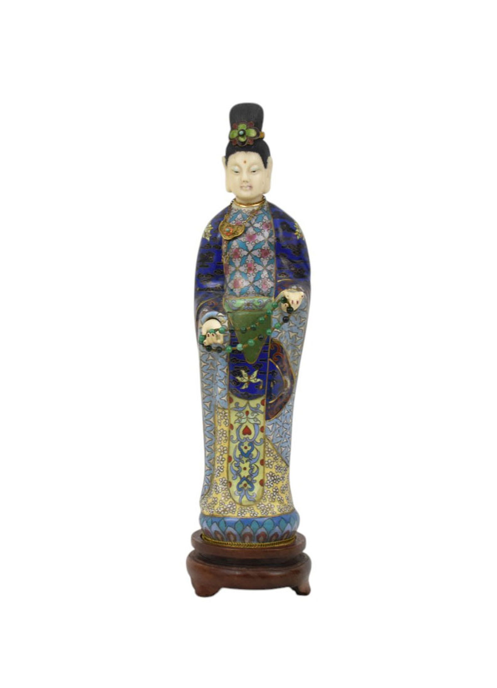 Chines Cloisonne and bone carved Guanyin- standing and holding bead necklace. On a 1 1/4" circular: Chines Cloisonne and bone carved Guanyin- standing and holding bead necklace. On a 1 1/4" circular carved wood base. Onverall 12 inches tall