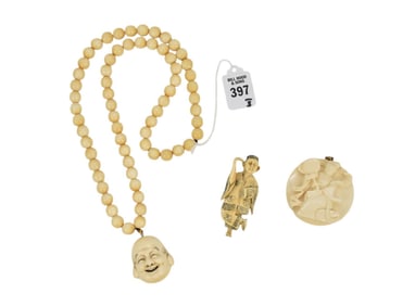Carved Pendants & Buddha Necklace, Japan & China - A grouping of three carved bone items.