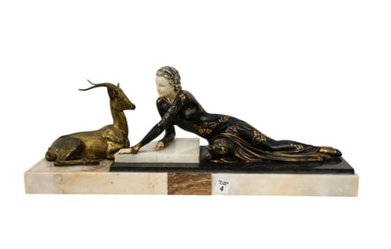 Art Deco French Gilt bronze, onyx and ivorine sculpture. Depicting a reclining female figure, with